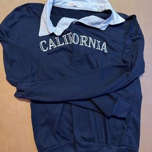 Blue long sleeve crewneck collared white with white letters that say California